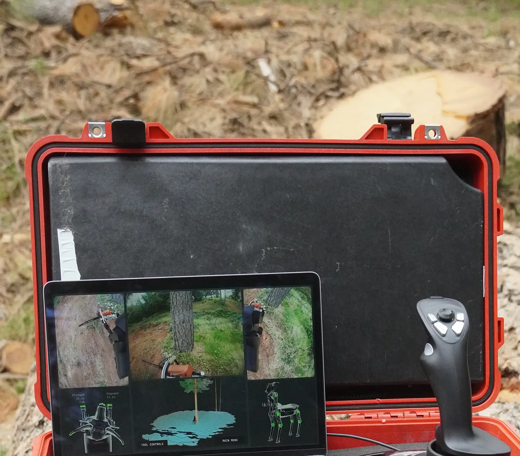 a laptop in a toolcase with a joystick showing the control UI for the threehalves robot