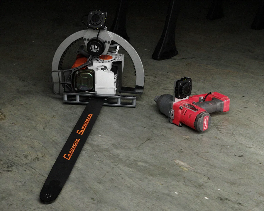 a chainsaw and impact gun retrofitted to quickly connect to the wrist of the threehalves robot